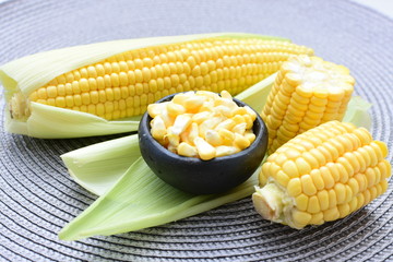  fresh organic corn in leaf, shelled and in pieces