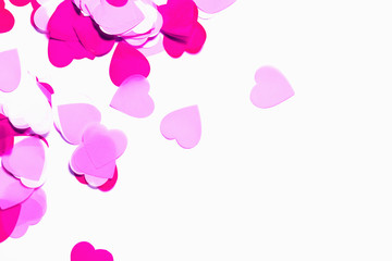 Colorful confetti in a heart shape isolated on white background. Valentine day concept.