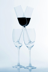 four glasses of wine on a light background