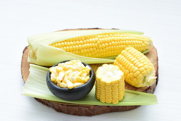  fresh organic corn in leaf, shelled and in pieces
