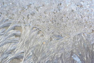 ice patterns on frozen window. natural textures and backgrounds