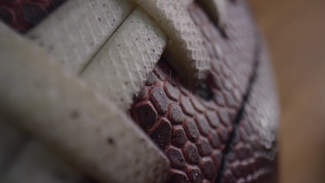 Close up macro of an American Football showing the texture of the leather and laces