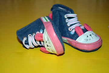 Blue kids shoes with pink soles and pink and white laces. Stylish baby. Fashion footwear. Children's sports shoes. Fashion