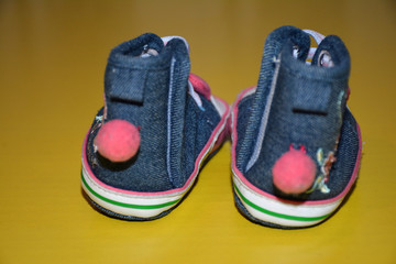 Blue kids shoes with pink soles and pink and white laces. Stylish baby. Fashion footwear. Children's sports shoes. Fashion