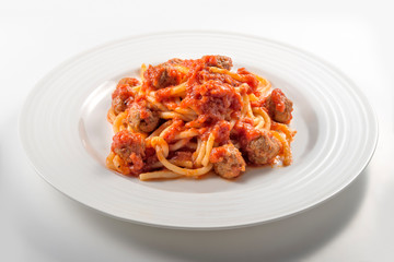 Plate of spaghetti with tomato and meatballs