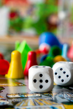 Concept Of Board Games. Dice, Chips And Cards On A Green Background Copy Space