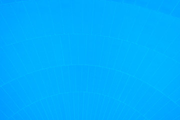 Pattern of converging lines on a dome with blue background.