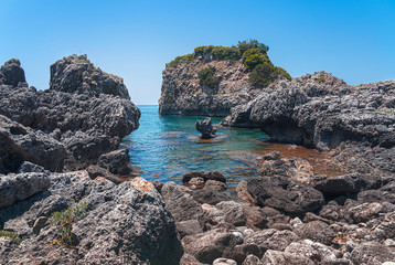 Fototapeta na wymiar landscape with rocky coast near the city of ammoundia, greece