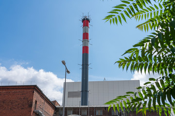 Obraz premium red white chimney of an industrial plant