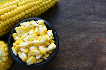 fresh organic corn in leaf, shelled and in pieces