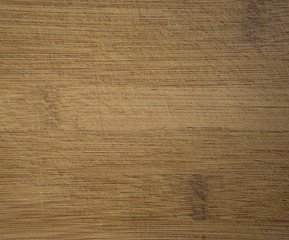 wooden cutting board, worn-out with kitchen knife marks, texture wood background