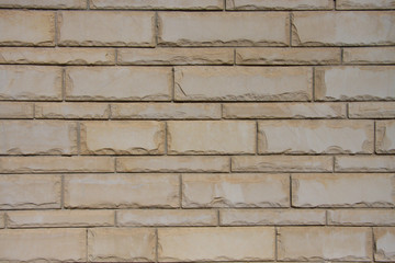 white brick wall with flat and large bricks