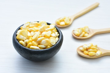 fresh organic corn in leaf, shelled and in pieces