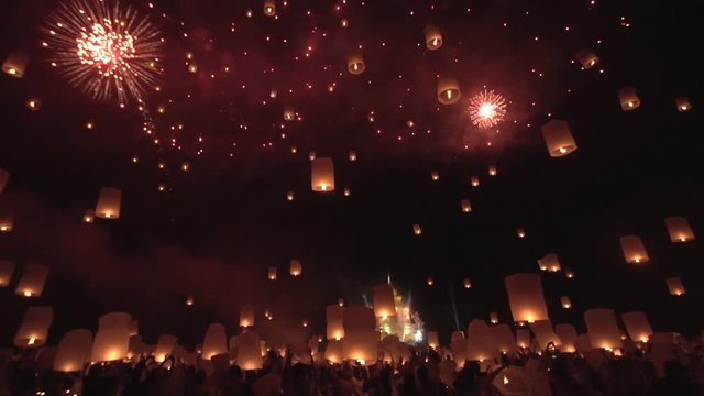 Release floating lanterns with fireworks on the sky , Lantern Yi peng festival, Chiang Mai, Thailand. .
