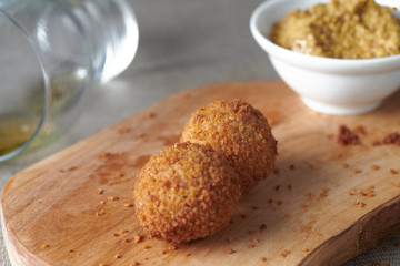 Bitterballen are a Dutch meat-based snack, made by making a very thick stew thickened with roux and beef stock and generously loaded with meat.