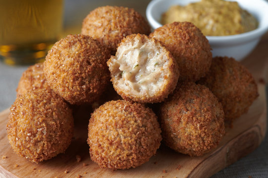 Bitterballen are a Dutch meat-based snack, made by making a very thick stew thickened with roux and beef stock and generously loaded with meat.