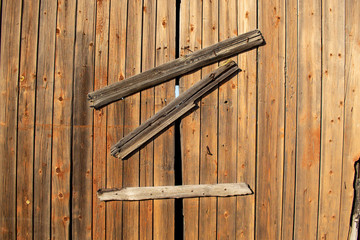 Old wooden boarded up door