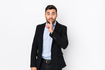 Young caucasian business man against a white background isolated keeping a secret or asking for silence.
