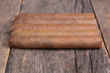 Cuban cigars on a wooden table