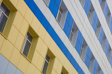 Three-colored building with production workshops and offices
