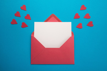 Red envelope with hearts on blue background	