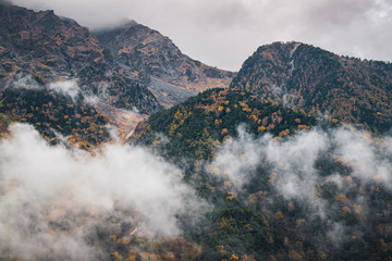 Autumn clouds on a rainy day over the Japanese Apls in Kamikochi valley, Nagano Perfecture, Japan.