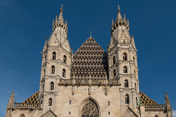 Fototapeta premium Vienna, Austria - June 4, 2019; Roof and towers of the Stephansdom, the largest church in the center of Vienna
