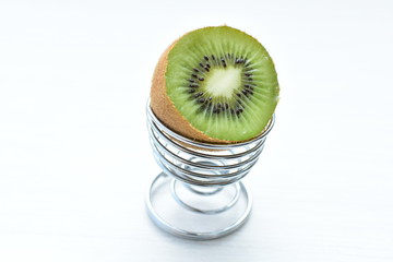  Fresh whole kiwi and half kiwi showing its texture