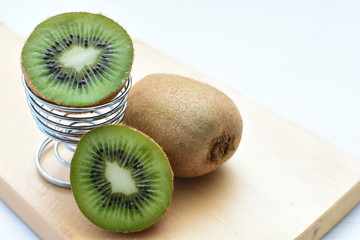  Fresh whole kiwi and half kiwi showing its texture