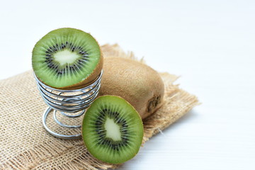  Fresh whole kiwi and half kiwi showing its texture