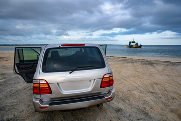 Fototapeta na wymiar Ferry Crossing 4WD Fraser Island, Driving on Beaches of Fraser Island Great Sandy National Park, Queensland Australia.
