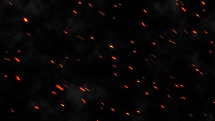 A lot of bright sparks are flying from the fire at night