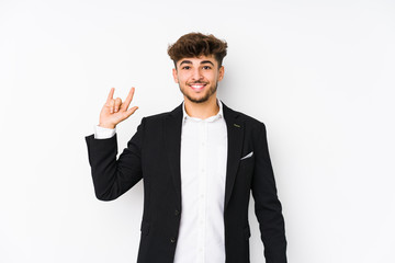 Young arabian business man isolated showing a horns gesture as a revolution concept.
