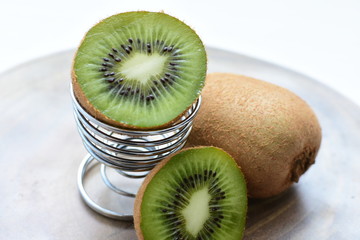  Fresh whole kiwi and half kiwi showing its texture