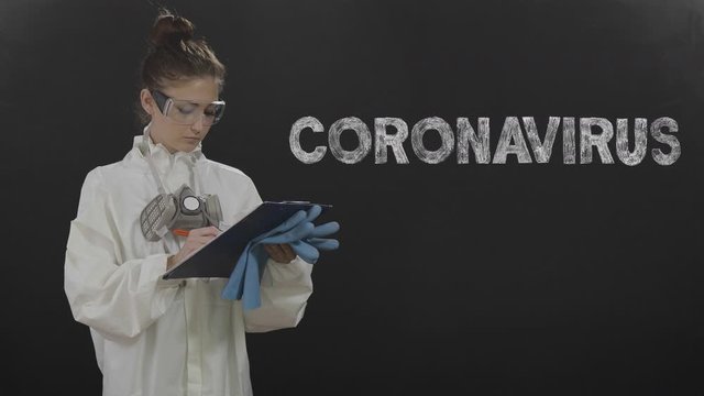 Coronavirus symbol. Word appear. Woman in protective suit and mask on dark background, virus spreading