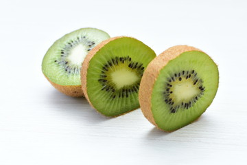  Fresh whole kiwi and half kiwi showing its texture