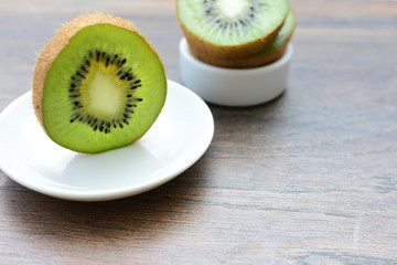  Fresh whole kiwi and half kiwi showing its texture