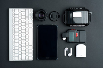 Professional photographic articles on a wooden floor,top view, computer keyboard, electronic...