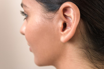 hearing problems. close up ear of a young woman. women hear everything - obrazy, fototapety, plakaty