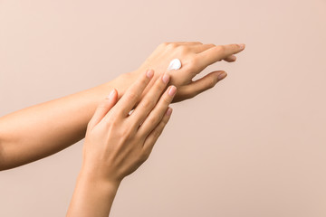 skincare. close up view of woman hand moisturising them with cream. skincare - obrazy, fototapety, plakaty