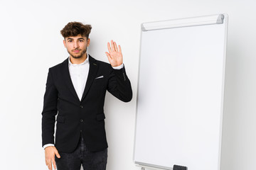 Young business coaching arabian man smiling cheerful showing number five with fingers.