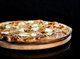 Close up italy hot pizza with cheese isolated on black background