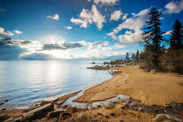 A beautiful pristine beach at sunset on the east shore of Lake Tahoe, Nevada.
