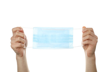 Hands holding medical protective mask isolated on white background. Сoronavirus protection