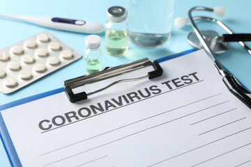 Composition of protective agents against Coronavirus on blue background, top view. Healthcare and medical concept