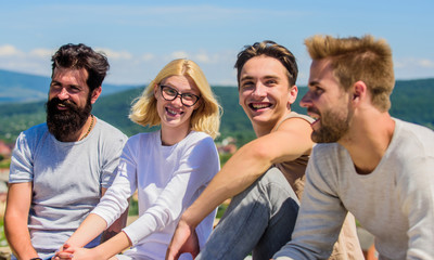 Spending time with friends. Summer vacation. Cheerful friends communicating. Hang out together. Men and woman talking nature background. Youth relaxing. Carefree friends concept. True friendship