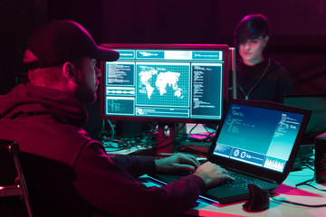 Hackers breaking server using multiple computers and infected virus ransomware. Cybercrime, information technology, phishing mail.