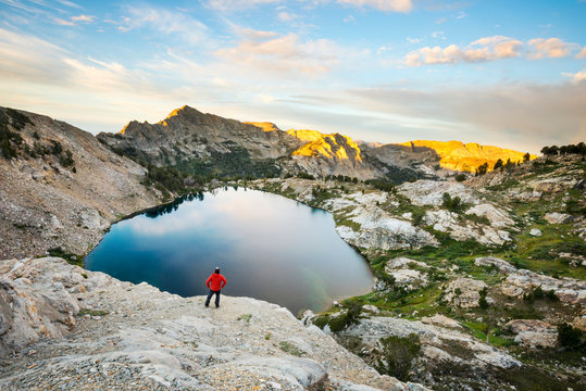 A man takes in the sunrise over Liberty Lake from Liberty Pass in the Ruby Mountains near Elko, Nevada.
