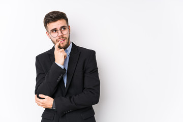 Young caucasian business man posing in a white background isolated Young caucasian business man relaxed thinking about something looking at a copy space.