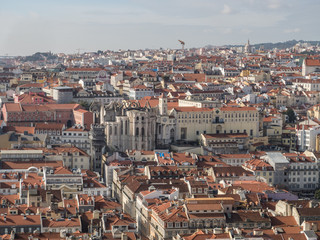 Fototapeta na wymiar Aerial view of Lisbon with Convent of Our Lady of Mount Carmel (Portuguese: Convento da Ordem do Carmo) and Santa Justa elevator in Portugal...